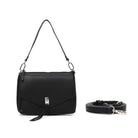 The black bag on its shoulder strap, with the cross body strap coiled beside it.