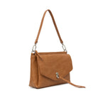 The tan bag at an angle, showing the flap and tassel.