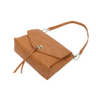 The tan bag lying flat, with the shoulder strap looped behind.