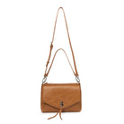 The tan bag with both straps attached, the shoulder strap and the longer cross body strap.