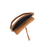 The tan bag open from above, showing a striped lining.
