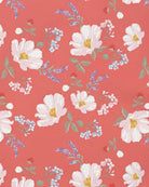 Close-up of the Camille Paradise print of white blossoms, lavender sprigs and small blue flowers on coral pink