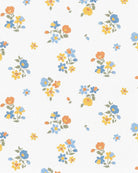 Close-up of the Maddie print of small blue, orange and yellow flowers on white