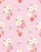 Close-up of the Strawberry Fields print of strawberries and white blossoms on pink