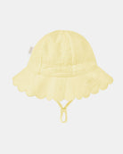 Plain side of the lemon Florence sunhat, opposite the toggle, showing the embroidered panels and Toshi label