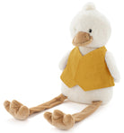 Cream plush duck with long dangly legs, sitting in a plain mustard linen bib.