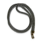 A crossbody phone lanyard coiled in a loop, the cord densely set with small silver sparkling stones, finished with a gold-tone clasp ring.