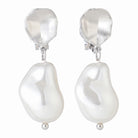 Silver-tone clip-on earrings with a hammered disc and baroque pearl drop