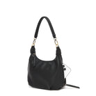 The black bag at an angle with a phone tucked into a side zip pocket.