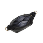 The black bag open from above, showing a striped lining and inside pockets.