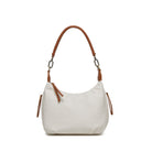White pebbled cross body bag with a tan shoulder strap, tan zip pulls and antique gold rings.