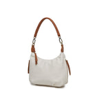 The white bag at an angle, showing a side zip pocket with a tan pull.