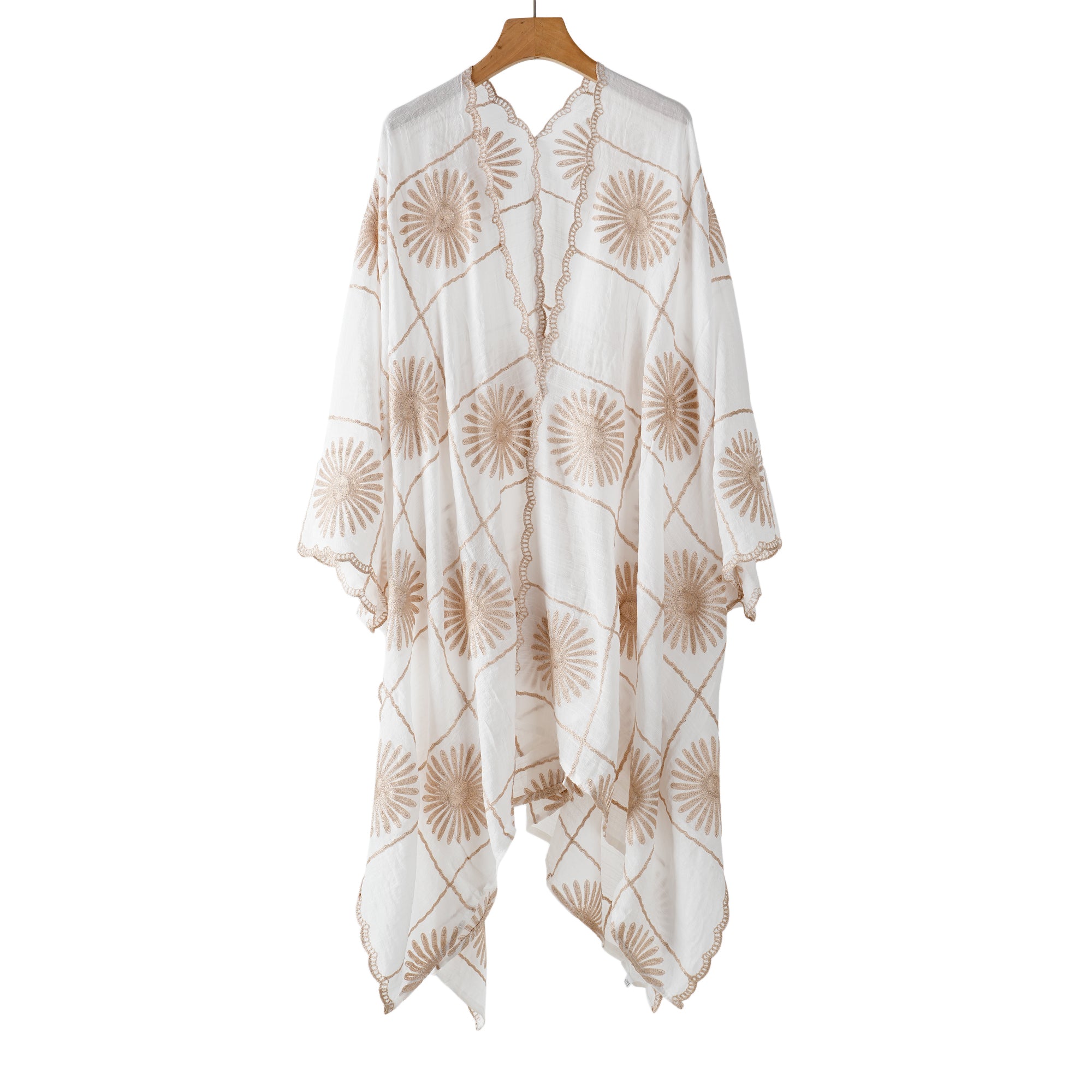 White open-front cover-up printed with tan fan flowers, shown on a hanger