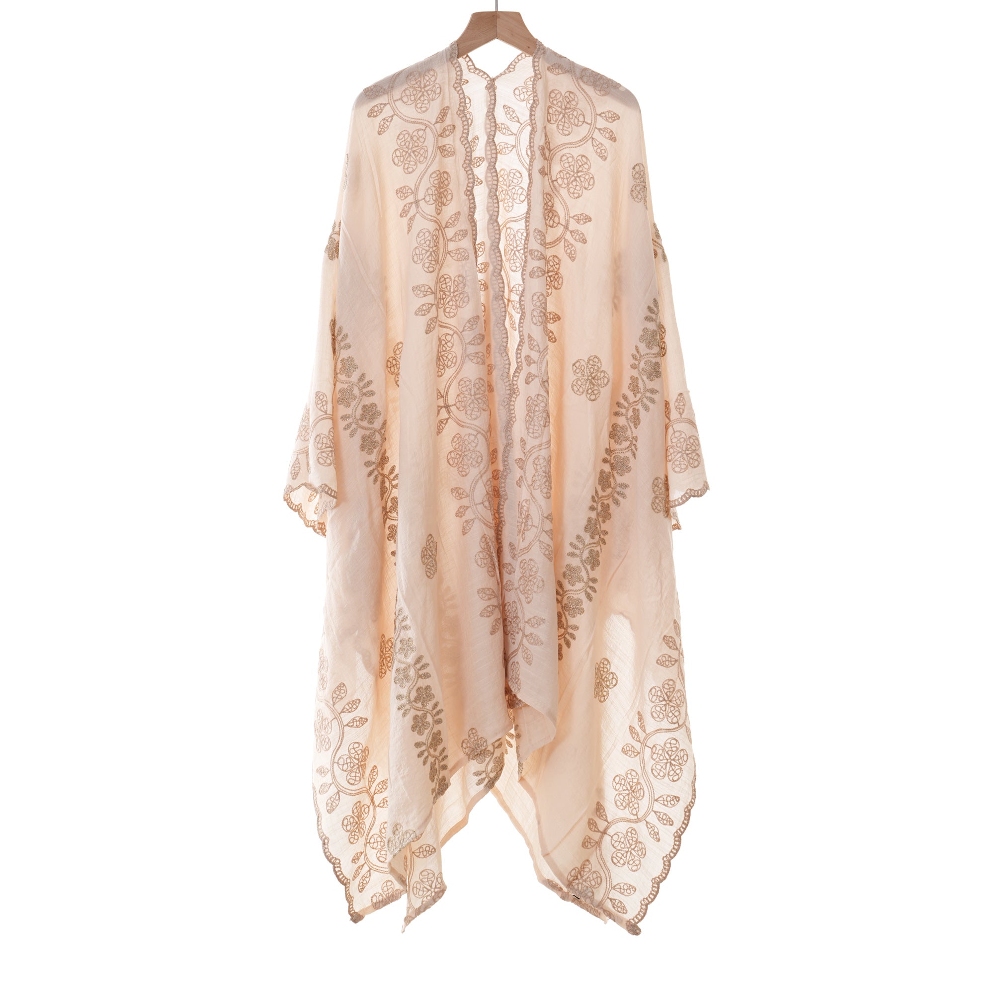 Cream open-front cover-up with a tonal garland print, shown on a hanger