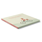 Angled view of the Celebrating You hardcover lying closed