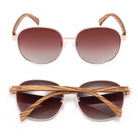 Cleo Bloom sunglasses front-on and folded from above, with brown gradient lenses and striped walnut arms