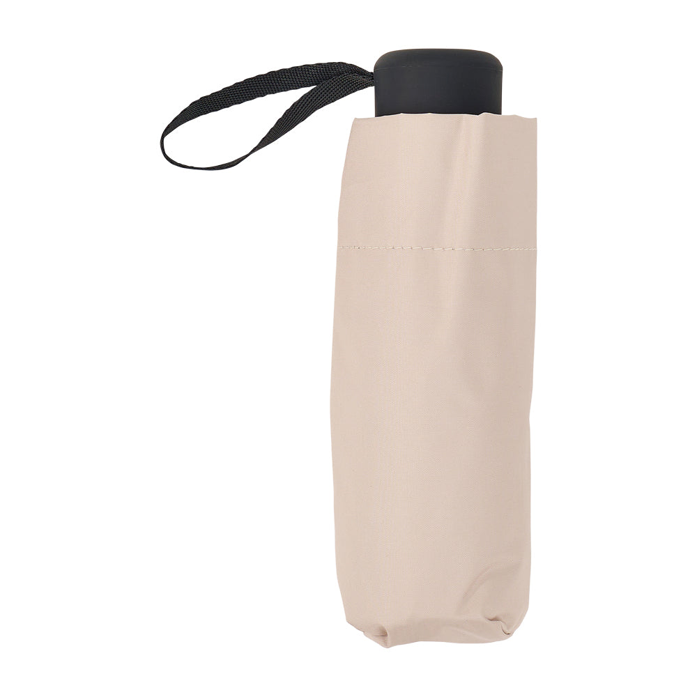 Oyster beige folded umbrella standing upright with a black handle and wrist strap.