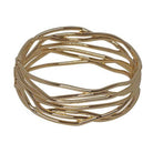 Wide gold hinged bangle of fine polished lines that cross and weave around the band, with open spaces between them.