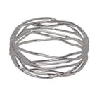 Wide silver hinged bangle of fine polished lines that cross and weave around the band, with open spaces between them.