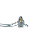 Side view of the pale blue wallet with the long strap attached.