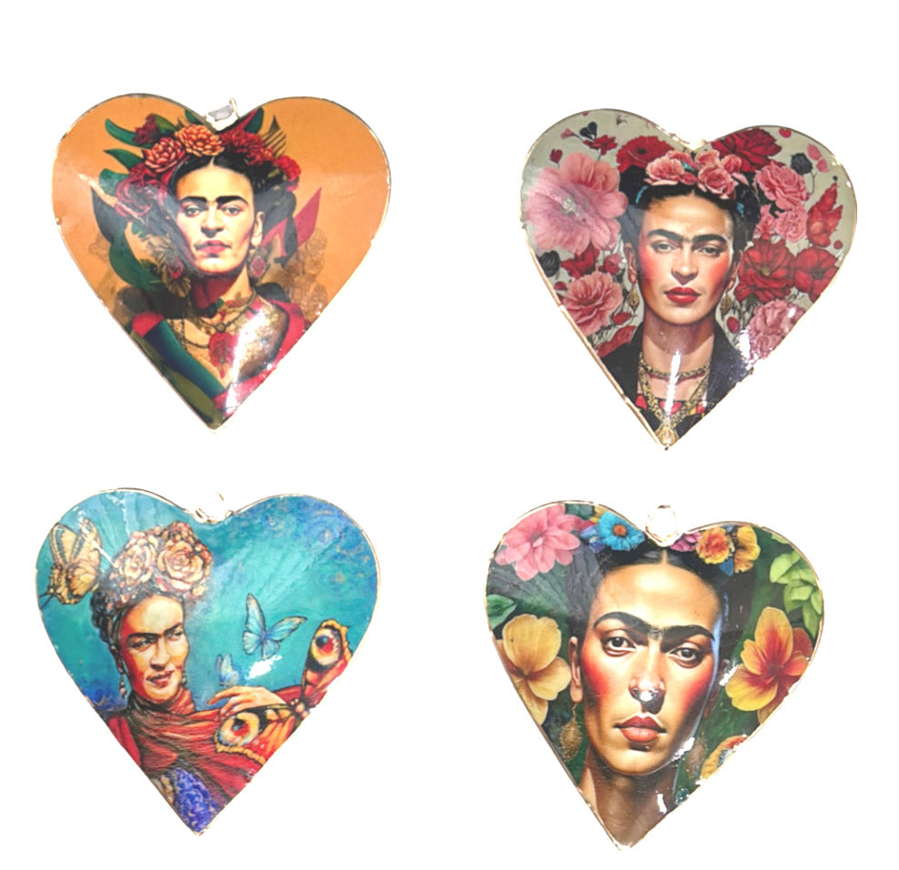 The designs in this set of Frida Kahlo hanging hearts: on ochre, among roses on pale grey, with butterflies on teal and with hibiscus on green
