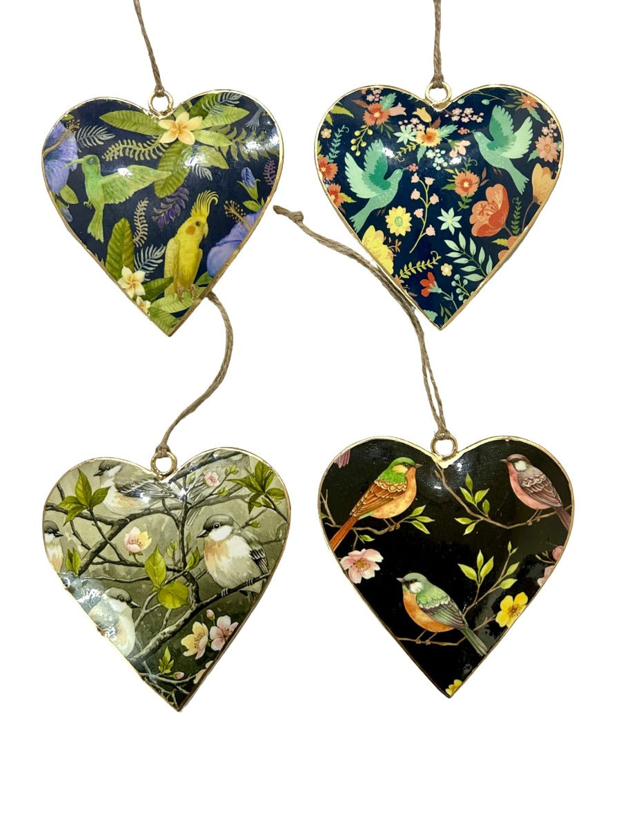 The designs in this set of hanging hearts on twine loops: a yellow cockatiel on navy, green doves on navy, small birds on a grey-green blossom branch and finches on black