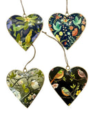 The designs in this set of hanging hearts on twine loops: a yellow cockatiel on navy, green doves on navy, small birds on a grey-green blossom branch and finches on black