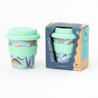 Dino cup with the lid on beside its navy Chino Club gift box
