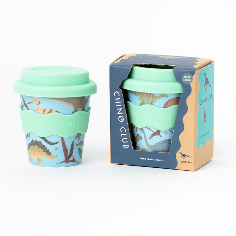 Dino cup with the lid on beside its navy Chino Club gift box