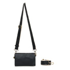 The black bag on its wide black cotton strap with cream edges.
