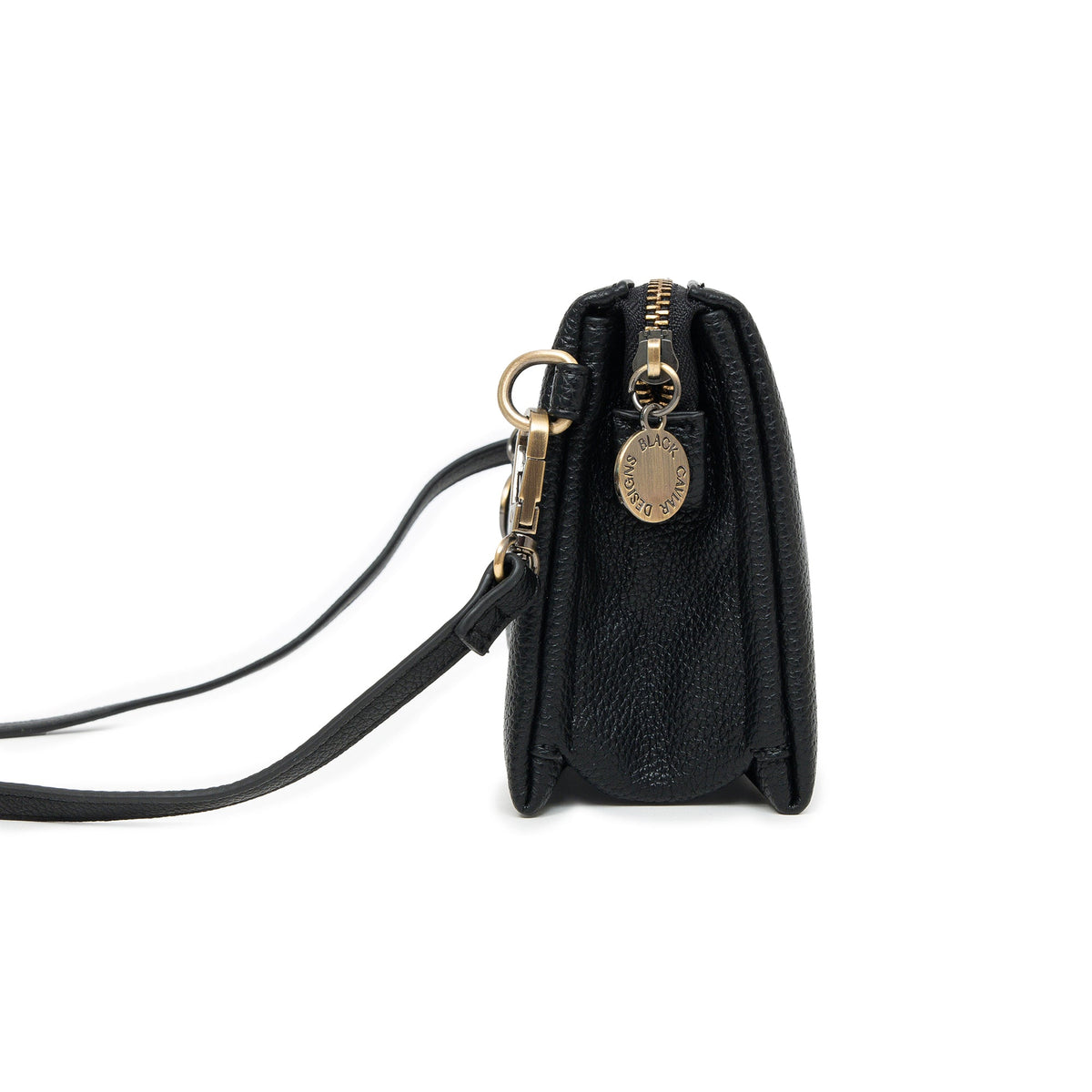 Side view of the black bag, showing its depth and a round charm.