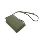 The olive bag lying at an angle with the slim strap looped behind.