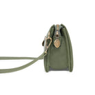 Side view of the olive bag, showing its depth and a round charm.
