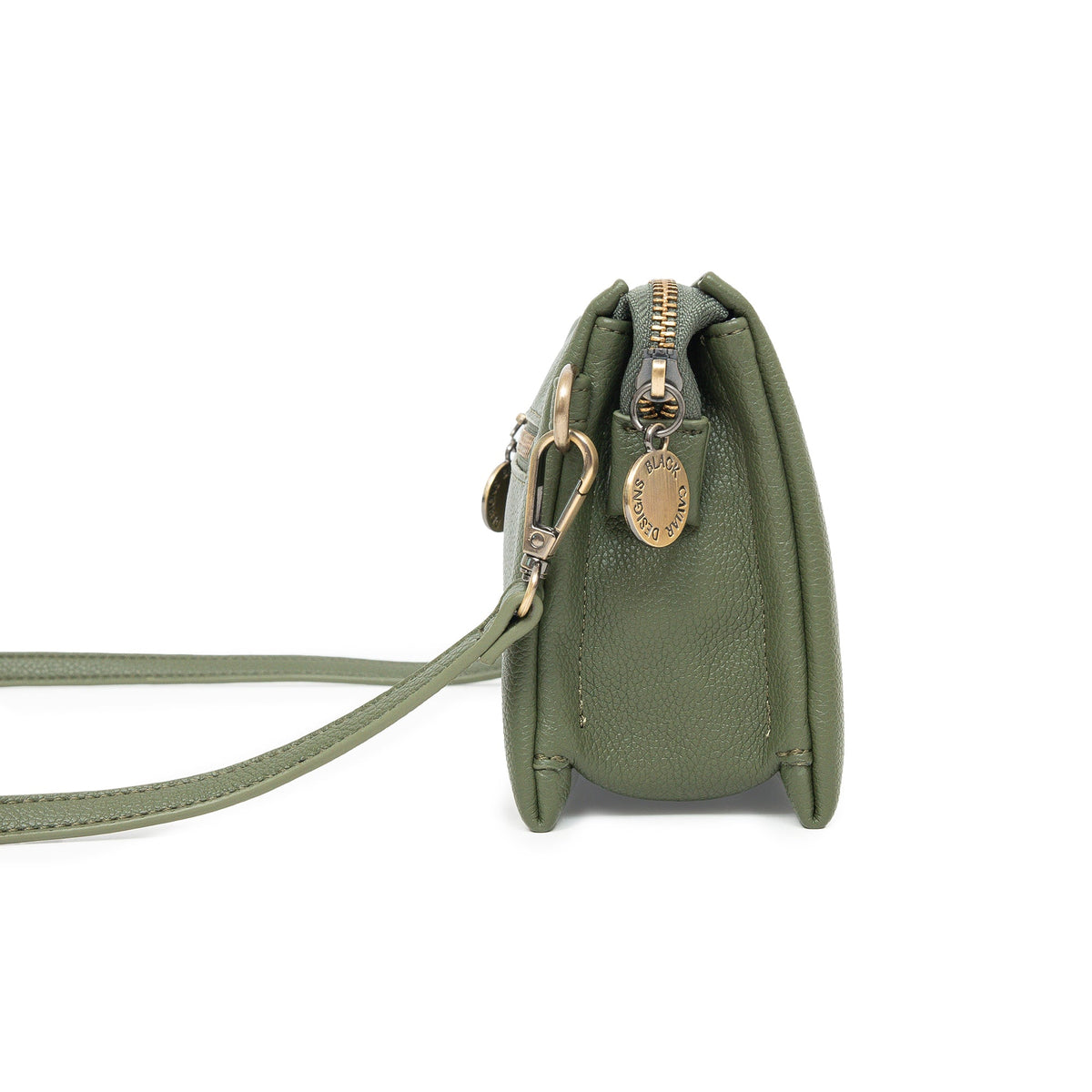 Side view of the olive bag, showing its depth and a round charm.