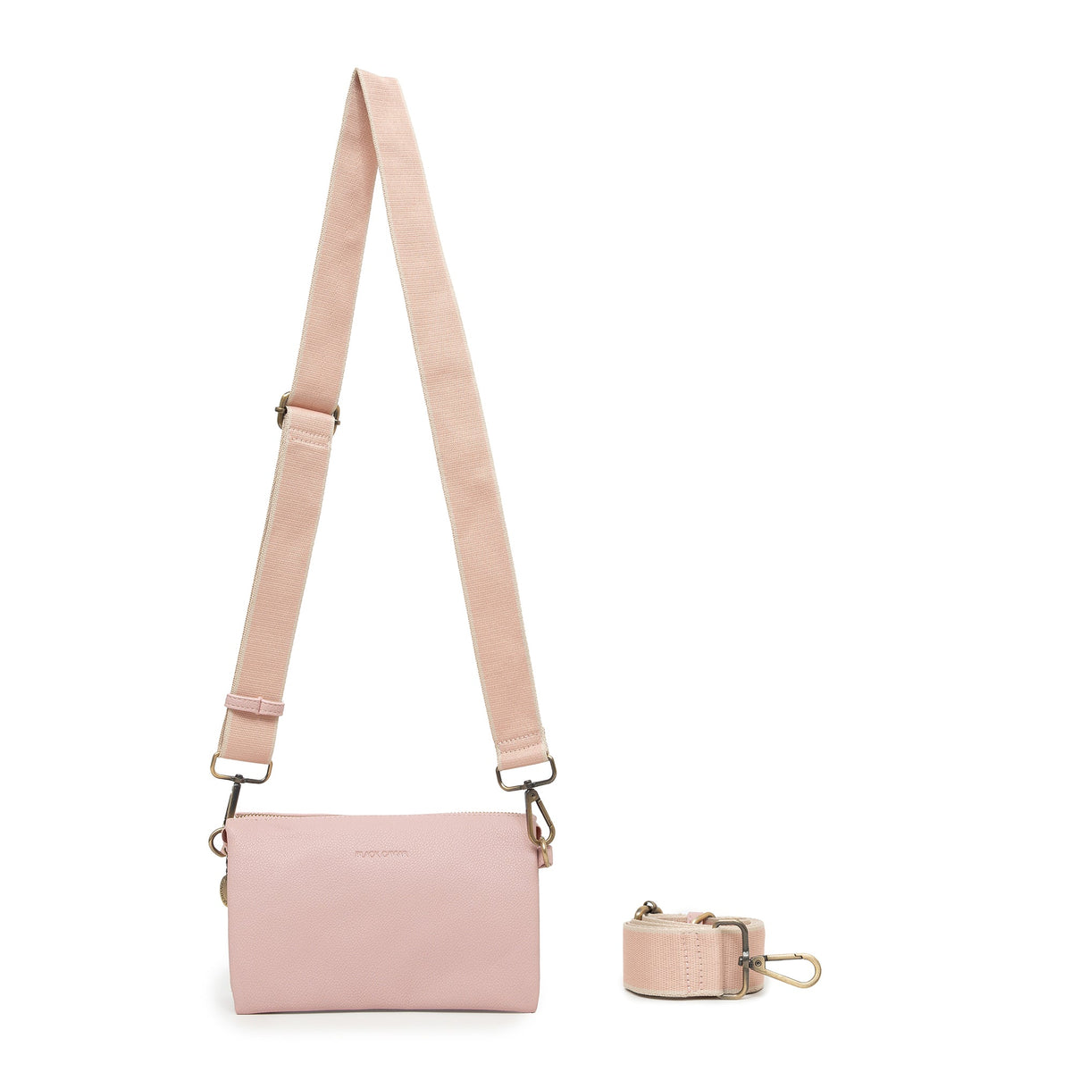 The pink bag on a wide pink and cream cotton strap.