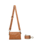The tan bag on a wide tan and cream cotton strap.