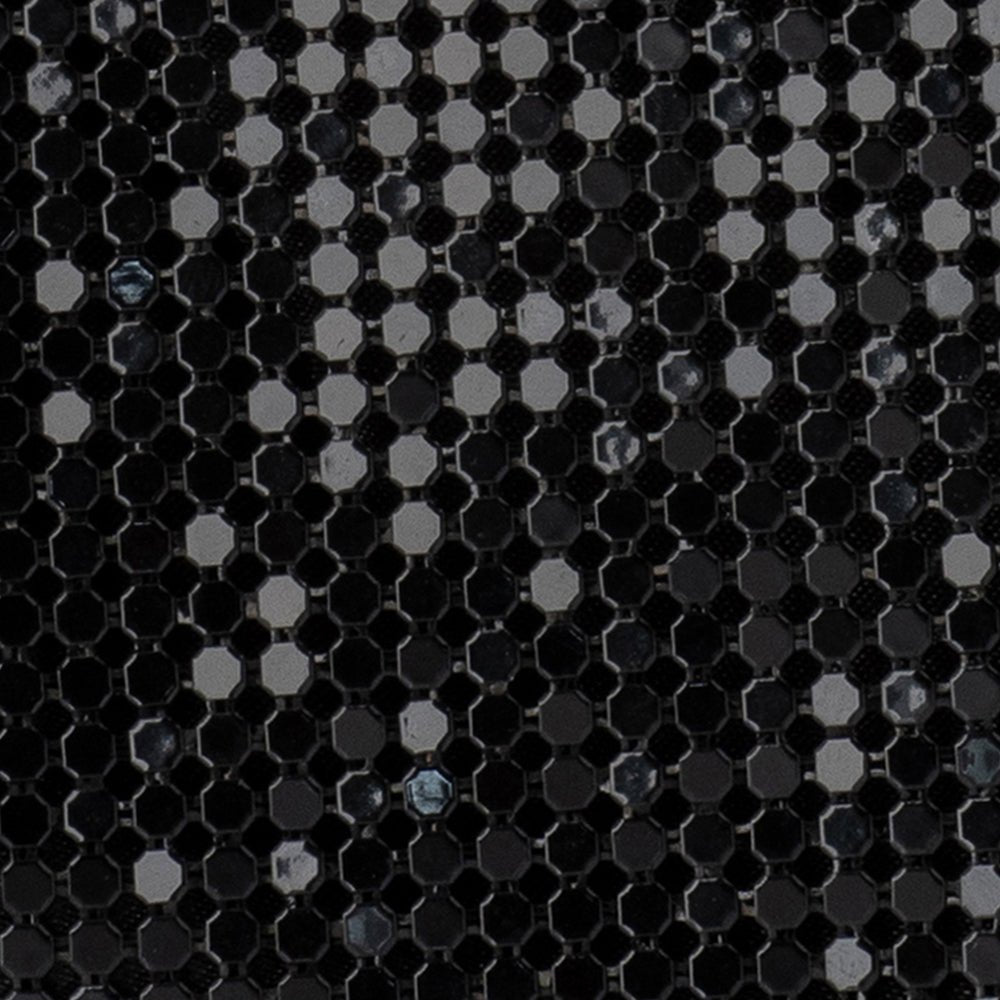 Close-up of the black metal mesh catching the light
