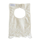 The back of the ivory linen bib with its crochet lace hem, label and neck tab.