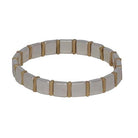Stretch bracelet of alternating silver squares and gold rectangles.