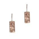 Pair of hammered rectangular drop earrings on fish hooks, rose gold with a small clear stone.
