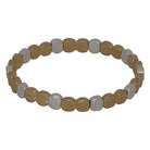 Stretch bracelet of small hammered discs alternating gold and silver.