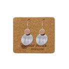 Pair of fish hook earrings, a small brushed rose gold-tone disc above a larger brushed silver-tone disc, on an Ear Mints card.