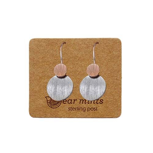 Pair of fish hook earrings, a small brushed rose gold-tone disc above a larger brushed silver-tone disc, on an Ear Mints card.