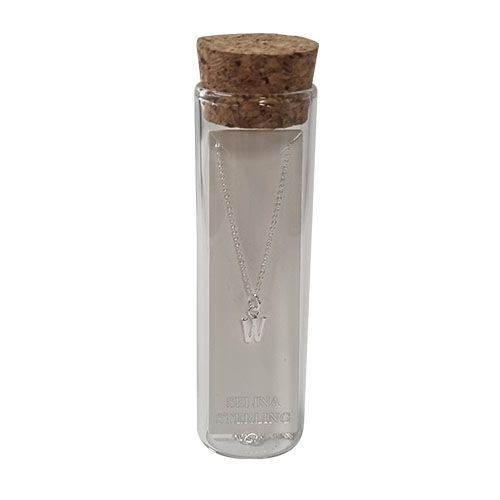 Selina sterling silver letter W initial necklace in its cork-topped glass gift tube.