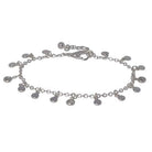 Silver-tone chain bracelet hung with small round discs and clear cubic zirconia drops, with a lobster clasp and extender chain.