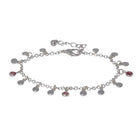 Silver-tone chain bracelet hung with small round discs and pink cubic zirconia drops, with a lobster clasp and extender chain.