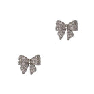 Pair of silver-tone bow stud earrings paved with clear cubic zirconia.