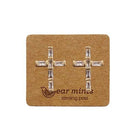 Gold-tone cubic zirconia cross stud earrings with baguette stones, on an Ear Mints card