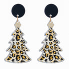 Christmas tree earrings in glitter-edged leopard print below a black disc stud