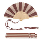 Open fan with brown and beige stripes, brown cord and printed gift box below